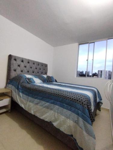 Ένα ή περισσότερα κρεβάτια σε δωμάτιο στο Agradable y cómodo Apartamento Eje Cafetero