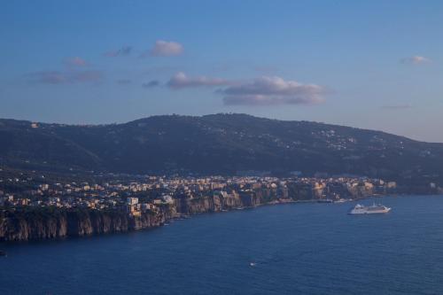 a boat in the middle of a large body of water at Baia Serena in Vico Equense