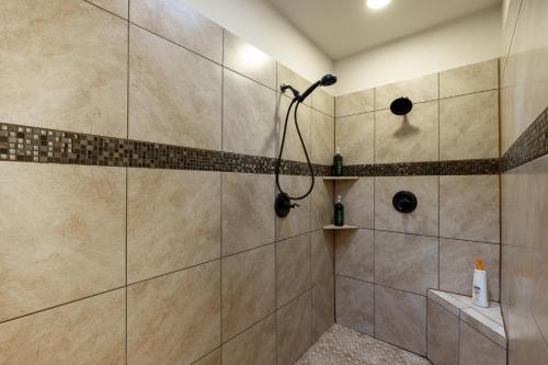 a bathroom with a shower with a shower head at Lakefront Serenity Escape on Lake Tawakoni in Quinlan