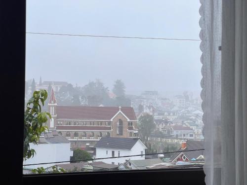 a view of a city from a window at Kimi Uchi Home in Da Lat