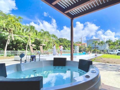 a hot tub in the backyard of a villa at SOLAIZ Ishigaki Island in Kabira