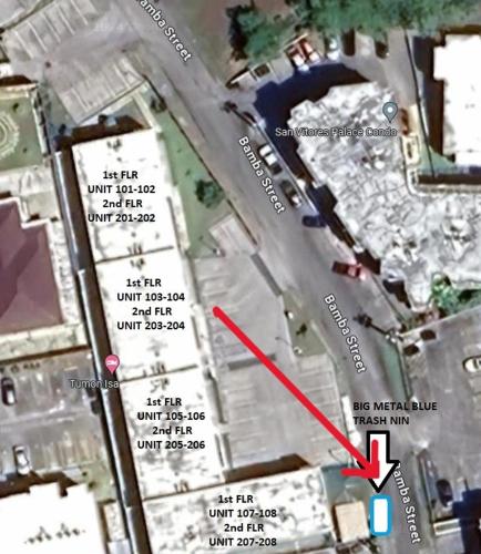 a map of a parking lot with a red arrow at Tumon Isa 16 Condo in Tamuning