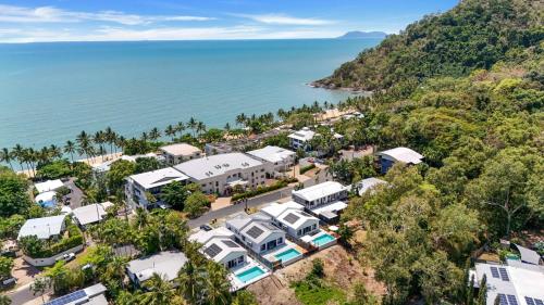 an aerial view of a resort next to the ocean at Belle Escapes Sea Bon in Trinity Beach