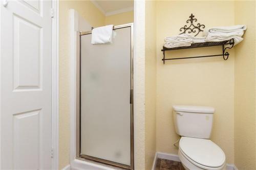 a bathroom with a toilet and a glass shower at Jacks Spot MIBC 116 in Mustang Beach