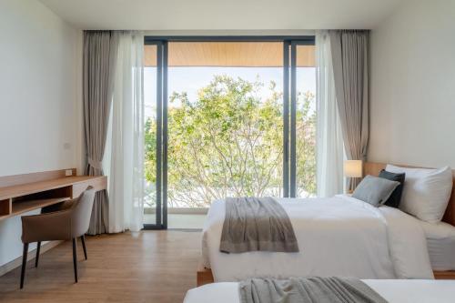 Postel nebo postele na pokoji v ubytování Modern Tropical Pool Villa - Saiyuan