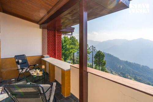 a balcony with a view of the mountains at StayVista at Cheerio - Elysium Estate 2BR Cottage with Valley View in Shimla