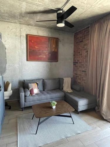 a living room with a couch and a coffee table at Prime Monterrey Stay 7 in Monterrey