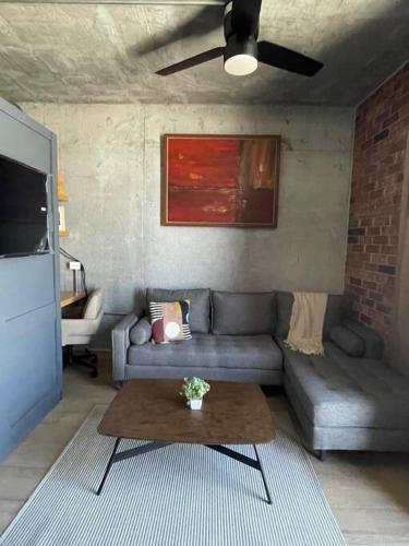 a living room with a couch and a table at Prime Monterrey Stay 7 in Monterrey