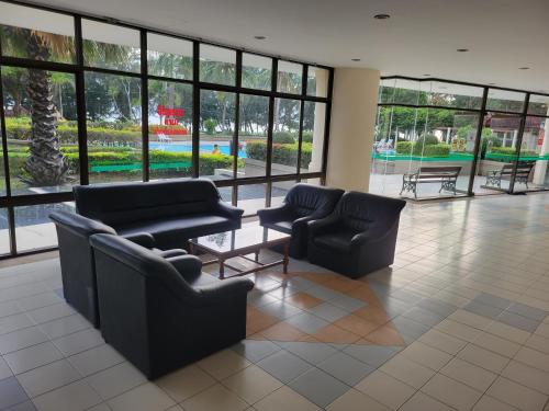 a lobby with couches and chairs in a building at VIP 375 large studio, ocean view in Rayong
