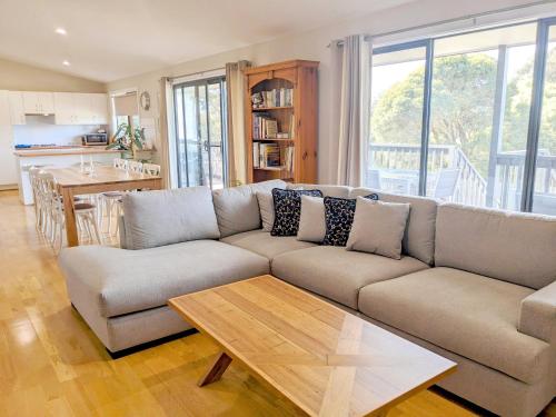 a living room with a couch and a table at Kanangra Place, Yarra Valley in Woori Yallock