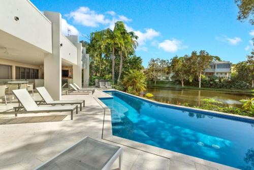an image of a swimming pool in a house at Villa 8 The Lakes in Yaroomba