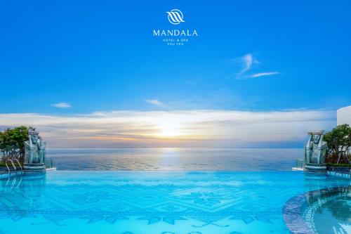 a view of the ocean from a hotel swimming pool at Mandala Hotel & Spa Phú Yên - 24hours Stay in Tuy Hoa