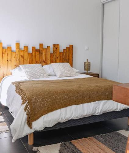 Una cama o camas en una habitación de Le Jardin d'Amina
