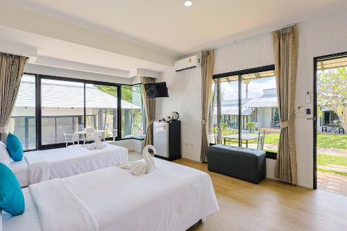 Postel nebo postele na pokoji v ubytování Peace Garden Resort, Koh Samui