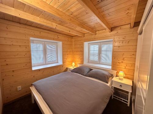 Postel nebo postele na pokoji v ubytování Apartmány Hanička