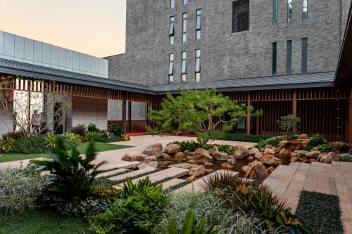 a garden in front of a building at Ascott Fengyishan Shenzhen in Shenzhen