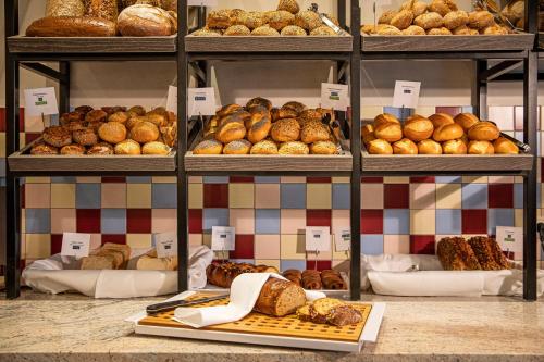 a bakery with lots of different types of bread at TUI BLUE Sylt in Rantum