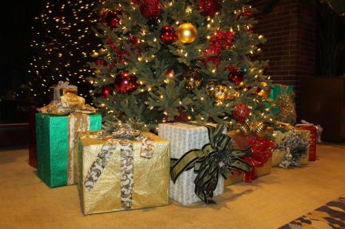 a christmas tree with presents under a christmas tree at Hyatt Lodge Oak Brook Chicago in Oak Brook