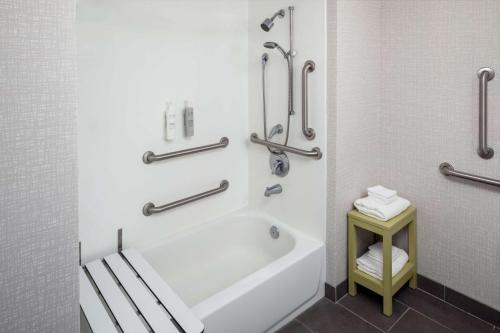 a bathroom with a bath tub and a sink at Hampton Inn & Suites Savannah - I-95 South - Gateway in Savannah