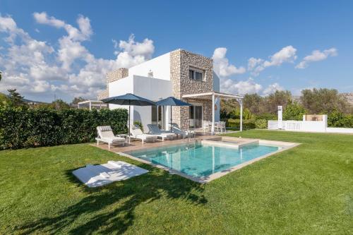 a villa with a swimming pool in a yard at OSSIANO POOL VILLAS, Heating Pool, 2 min drive to Haraki Beach & 10 to Lindos in Haraki