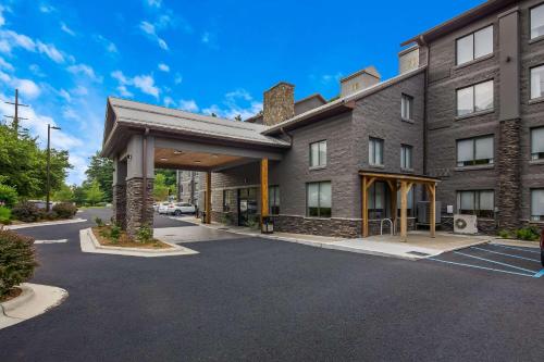 an empty parking lot in front of a building at Graystone Lodge, an Ascend Collection Hotel in Boone