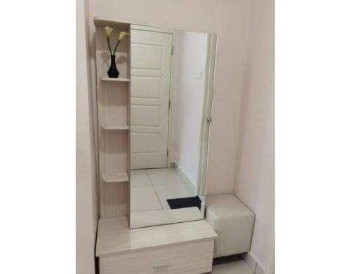 a dressing room with a mirror and some shelves at Mansion One Luxurious Seaview Vacation Homes in George Town