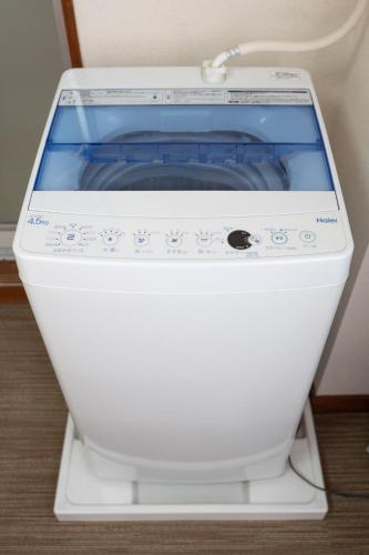 a white sewing machine sitting on a table at カプリス豊平公園305 in Sapporo