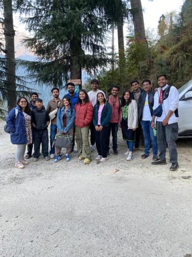 a group of people posing for a picture at Avasaa Café and Stay in Jibhi