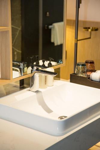 Koupelna v ubytování 柏高雅酒店江门新会时代城店 pacoHotel
