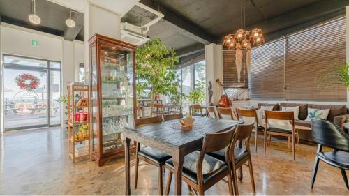 a dining room with a table and chairs at Gyeongju Neulsiwon Pension in Gyeongju
