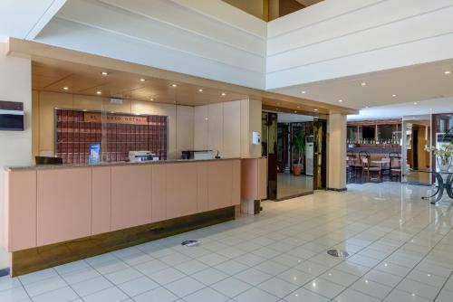 a lobby with a bar in a building at El Greco Hotel in Heraklio Town