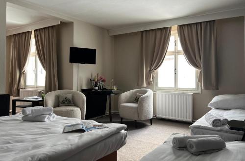 Postel nebo postele na pokoji v ubytování Hotel Lomnice