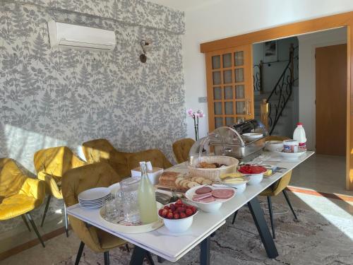 a table with food on it in a room at Letymvou Terrace in Letimbou