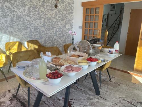 a table with a bunch of food on it at Letymvou Terrace in Letimbou