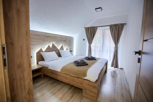 Postel nebo postele na pokoji v ubytování Resort Biela Skala - CHALETKA Chopok Jasná Juh