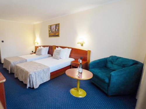 Ένα ή περισσότερα κρεβάτια σε δωμάτιο στο Hotel Orbita