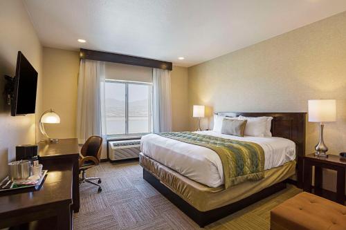 a hotel room with a large bed and a window at The Hotel at Sunland Park Casino El Paso, an Ascend Collection Hotel in El Paso