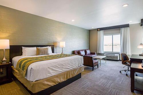 a hotel room with a bed and a desk at The Hotel at Sunland Park Casino El Paso, an Ascend Collection Hotel in El Paso