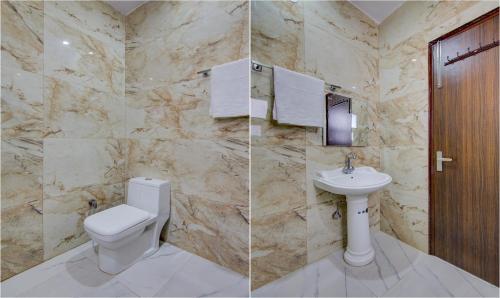 a bathroom with a toilet and a sink at Treebo The King Mohali in Mohali