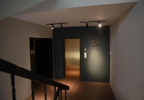 a hallway with a sign on the wall at Room V Jalan Sultanah By SECOM in Batu Pahat