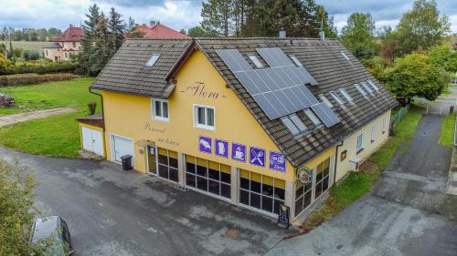 an overhead view of a building with solar panels on the roof at Penzion Flora in Konstantinovy Lázně