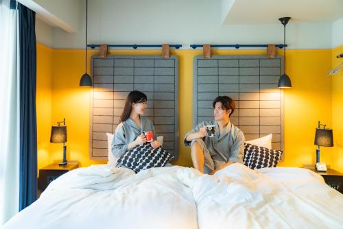 Postel nebo postele na pokoji v ubytování Hotel Resol Yokohama Sakuragicho