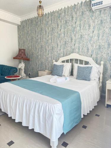 Una cama o camas en una habitación de ELLA STUDIO 68