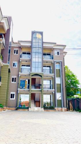 a large apartment building with a lot of windows at Lake View Muyenga Apartment in Kampala