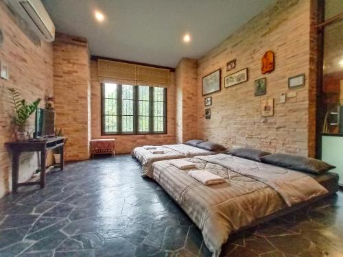 Ένα ή περισσότερα κρεβάτια σε δωμάτιο στο Yuva Homestay