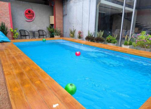 a swimming pool with blue water and balls in it at The Morning mini house aonang - 15-45 years old only in Ao Nang Beach
