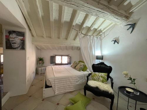 Ένα ή περισσότερα κρεβάτια σε δωμάτιο στο B&B Tuscany Lodge