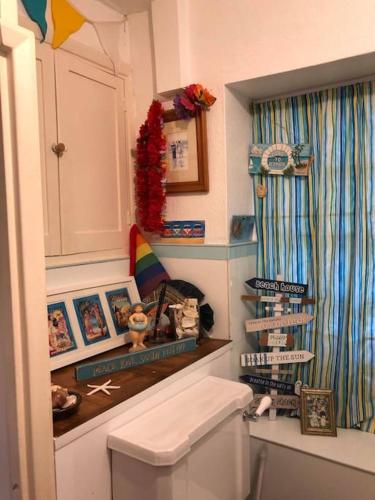 a bathroom with a white toilet in a room at Historical Country Retreat with Modern Amenities in Gravesend