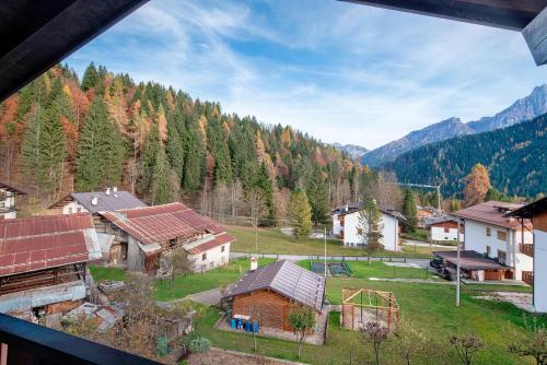 an aerial view of a village in the mountains at Appartamenti Minotto Falcade in Falcade