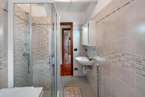 a bathroom with a sink and a shower at Appartamenti Minotto Falcade in Falcade